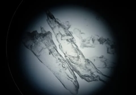 Translucent drug crystals under the microscope for scientific research Stock Photos