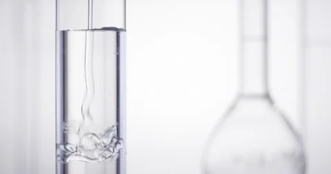 Translucent gel being dropped into test tube Vidéo 74853560