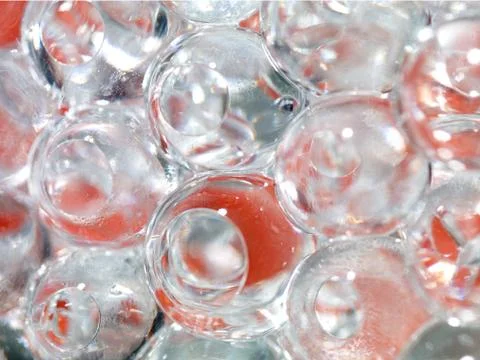 Translucent ice balls with red background 스톡 일러스트