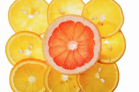 Translucent orange and grapefruit slices on a white background, citrus fruit  库存照片
