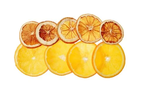 Translucent orange slices on a white background, dry and ripe slices together Stock Photos