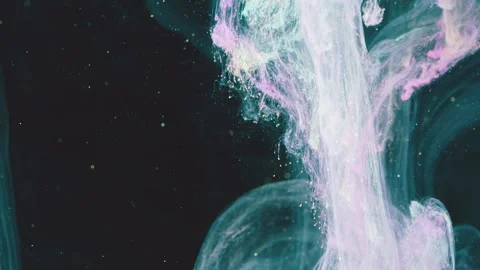 Translucent pastel plume of ink sinking through dark fluid with frothy droplets  Stock Footage 341465051