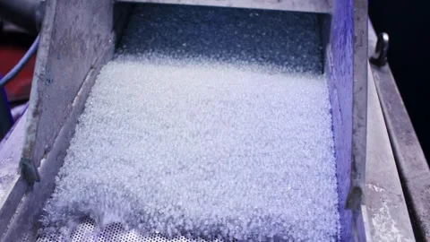 Translucent Plastic Pellets on Perforated Sieve, Sorting Machine, Macro Shot Stock Footage 341299260