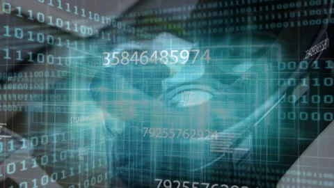 Translucent teal skull hologram rotating and pulsing over tablet on desk, with Stock Footage 334039336