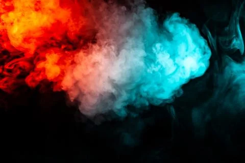 Translucent, thick smoke, illuminated by light against a dark background, div Stock Photos