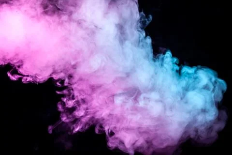 Translucent, thick smoke, illuminated by light against a dark background, div Stock Photos
