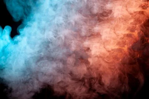 Translucent, thick smoke, illuminated by light against a dark background, div Stock Photos