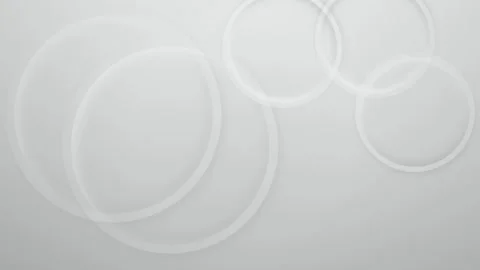 Translucent three dimensional rings drift in a seamless loop Stock Footage 341859428