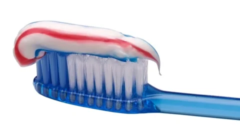 Translucent tooth brush with toothpaste Stockbeeldmateriaal 8848072
