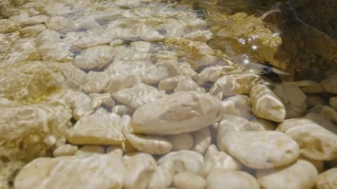 The translucent water of the Mediterranean Sea on the pebbles of a calanque Stock Footage 287311088