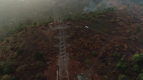 Transmission Lines over a Forest Hill Valley, Terrain, Fog, Morning Stock Footage