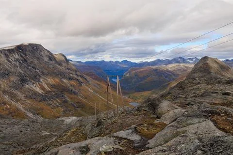 Transmission lines run across the rugged Tafjord hydropower landscape in Norw Stock Photos
