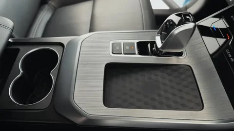 A transmission shift knob and wireless phone charger. Intimate Cabin Experience Stock Footage 257762629