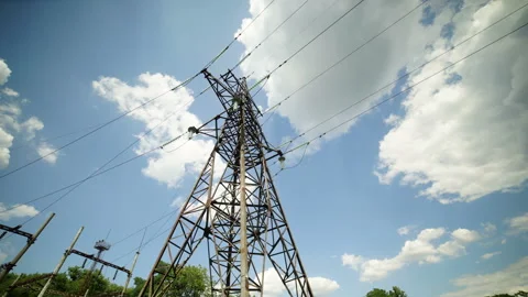 Transmission tower supporting high voltage overhead transmission line Video stock 165364055