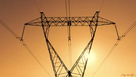 Transmission tower supporting an overhead high voltage power line Stock Footage 139016547