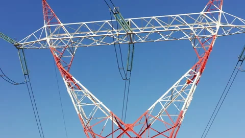 Transmission tower supporting an overhead high voltage power line Stock Footage 139023520