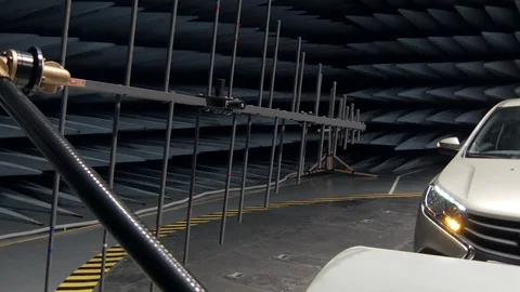 Transmitter is emitting waves on working automobile in anechoic test chamber Stock-Footage 90474575
