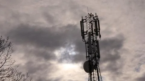 Transmitter tower with clouds in background Stock-Fotos