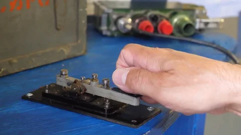 Transmitting message by morse code key Stock Footage 119136609