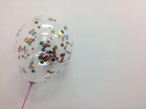 Transparent balloon with many small colored circles inside the balloon. Stock Photos