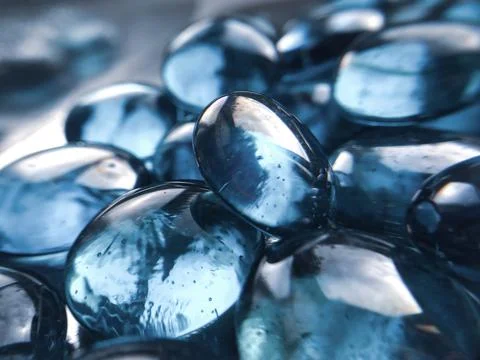 Transparent beautiful magic glass blue stones macro Stock Photos
