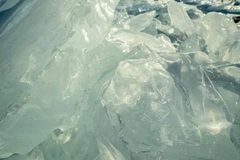 Transparent block of ice in the rays of the sun at sunset. Winter natural a.. Stock Photos