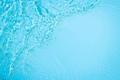 Transparent blue colored clear calm water surface texture Illustrazione stock