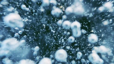 Transparent blue ice with cracks and bubbles on the frozen lake. Stock-Footage 298178231