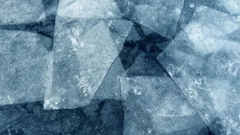 Transparent blue ice with cracks and bubbles on the frozen lake. Stock Footage 298178552