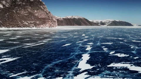 Transparent blue ice with cracks on Baikal lake in winter. Stock Footage 219956202