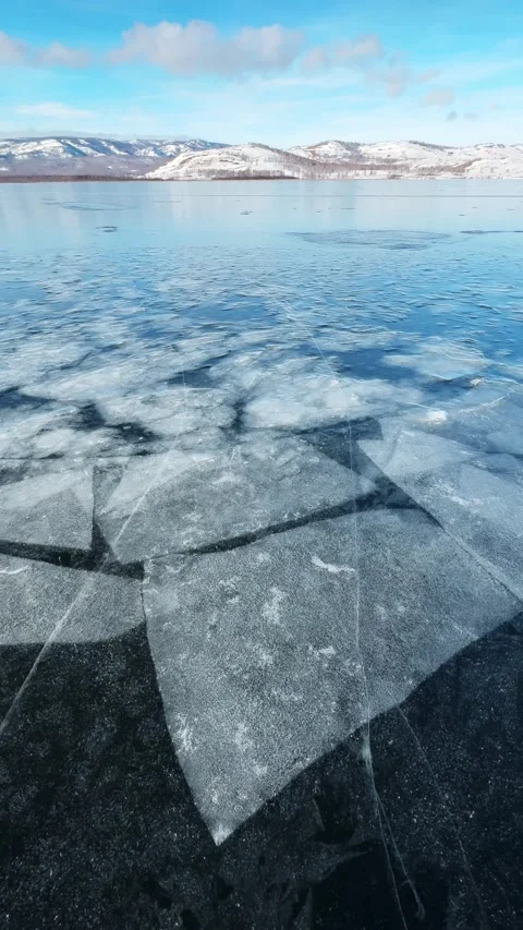 Transparent blue ice on the lake Stock Footage 298178579