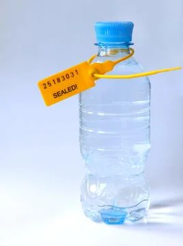 Transparent bottle full of clean drinking water sealed Stock Photos