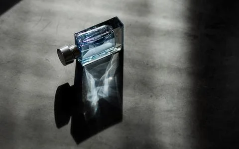 Transparent bottle of perfume Stock Photos