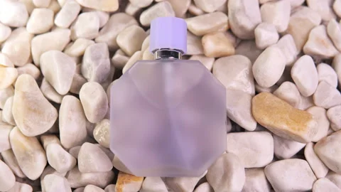 Transparent bottle of perfume on a white marble stones background. Top view. Stockbeeldmateriaal 220309342