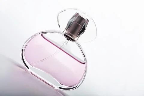 Transparent bottle of pink perfume Stock Photos
