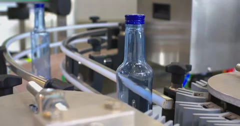Transparent Bottles Moving Through Automated Production Facility Stock Footage 329222407
