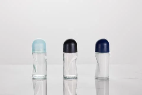 Transparent bottles roller deodorant isolated Stock Photos