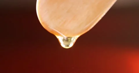 Transparent brown red liquid drips from wooden stick slow motion 4k movie Stock-Footage 164905797