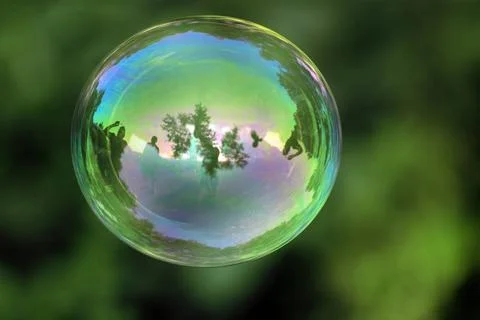 Transparent bubble with reflections on a green organic background transpar... Stock Photos