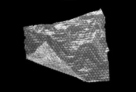 Transparent bubble wrap on black background, top view Stock Photos