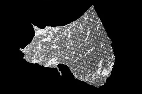 Transparent bubble wrap on black background, top view Stock Photos