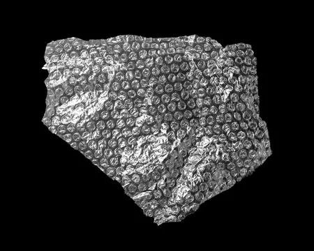 Transparent bubble wrap on black background, top view Stock Photos