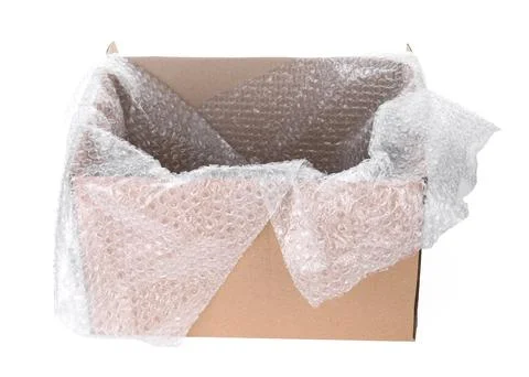 Transparent bubble wrap in cardboard box isolated on white Foto stock