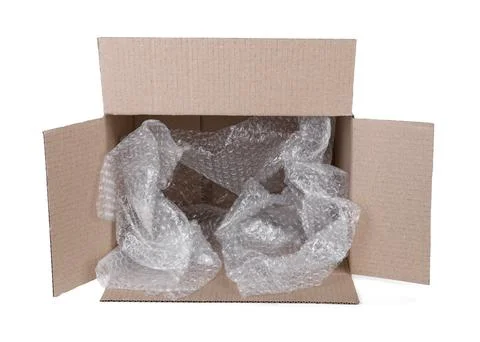Transparent bubble wrap in cardboard box isolated on white 스톡 사진