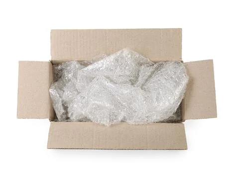 Transparent bubble wrap in cardboard box isolated on white 스톡 사진