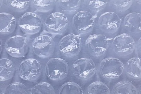 Transparent bubble wrap on gray background, closeup Foto stock