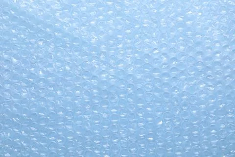 Transparent bubble wrap on light blue background, top view Foto stock