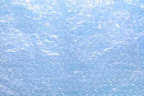 Transparent bubble wrap on light blue background, top view Foto stock