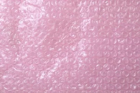 Transparent bubble wrap on pink background, top view Stock Photos