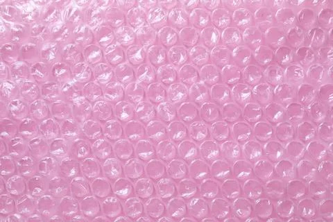 Transparent bubble wrap on pink background, top view Foto stock